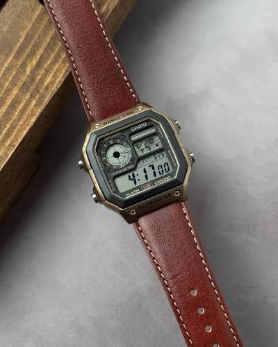 "The Casio Collection Watch AE-1200WHL-5AVEF World Time Digital Watch with Rich Brown Leather Strap for Men"